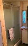 The full bathroom with updated shower & laundry area